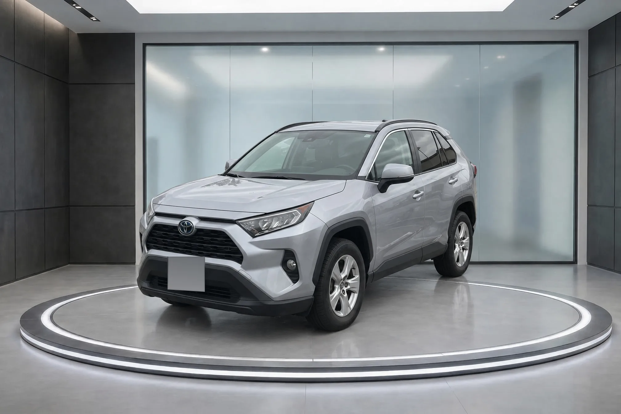 The same RAV4 from the lot photo, finished in the dark turntable