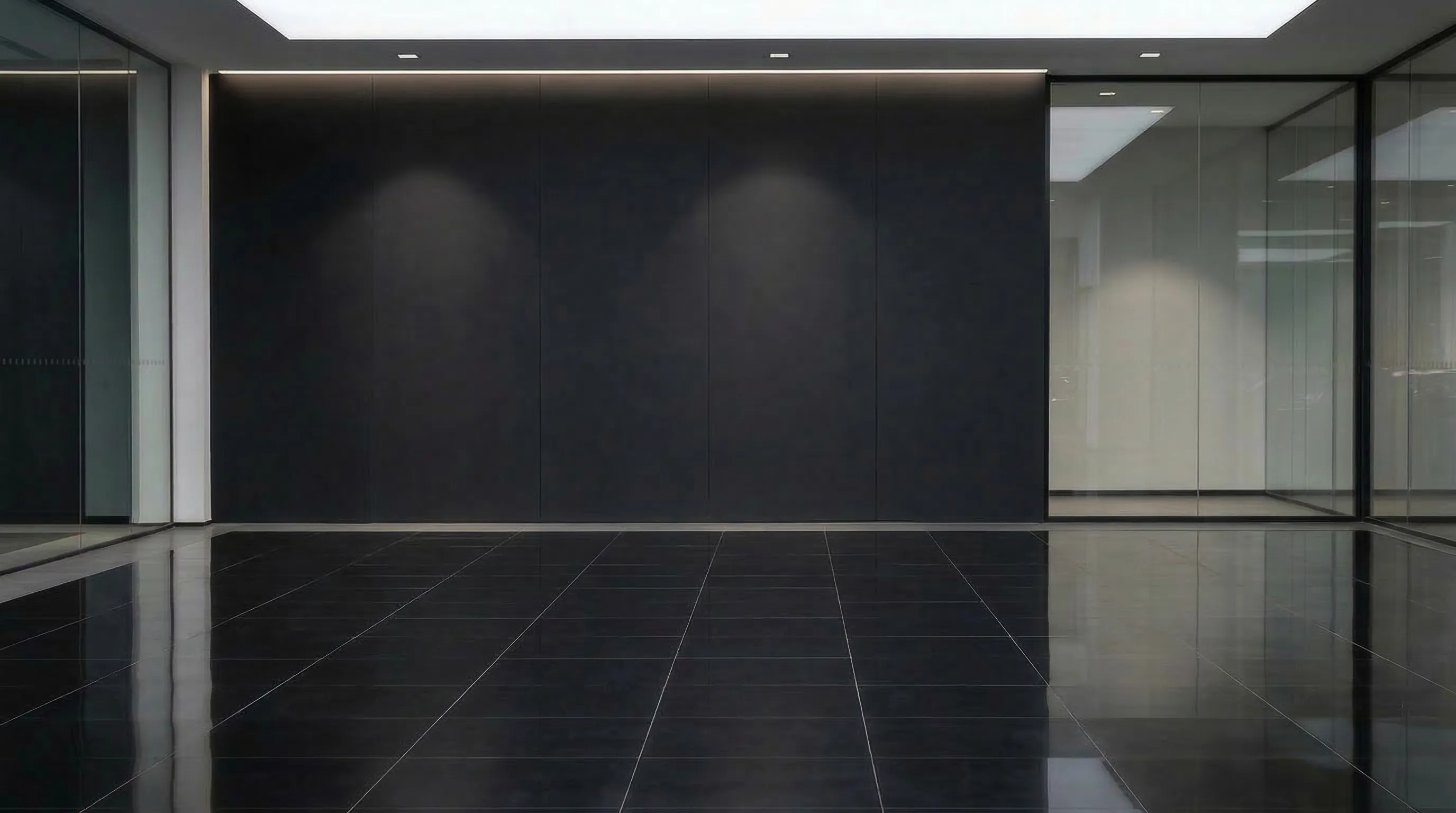 Car in black showroom with sleek minimalist setting