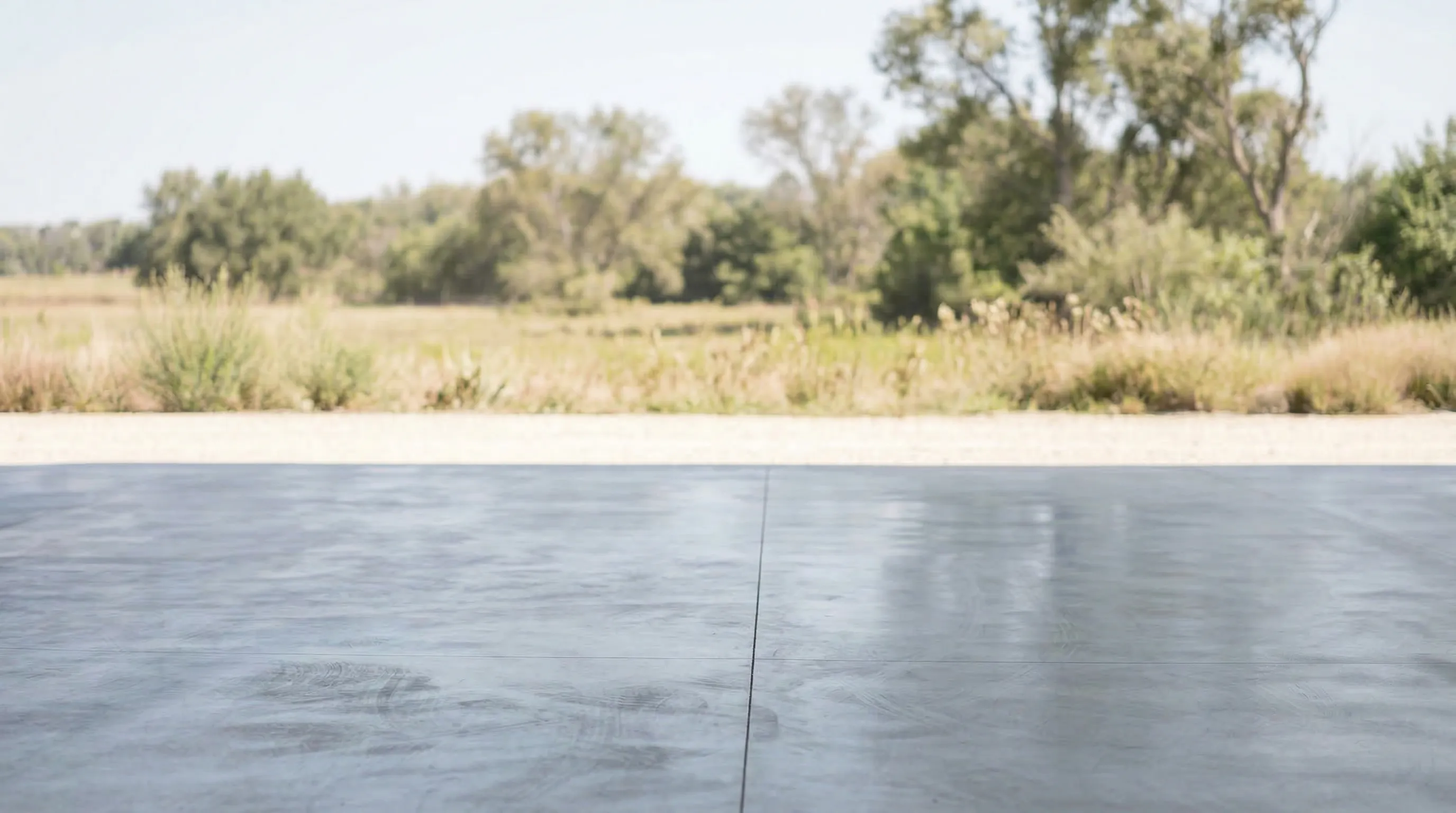 Car at countryside property with natural surroundings